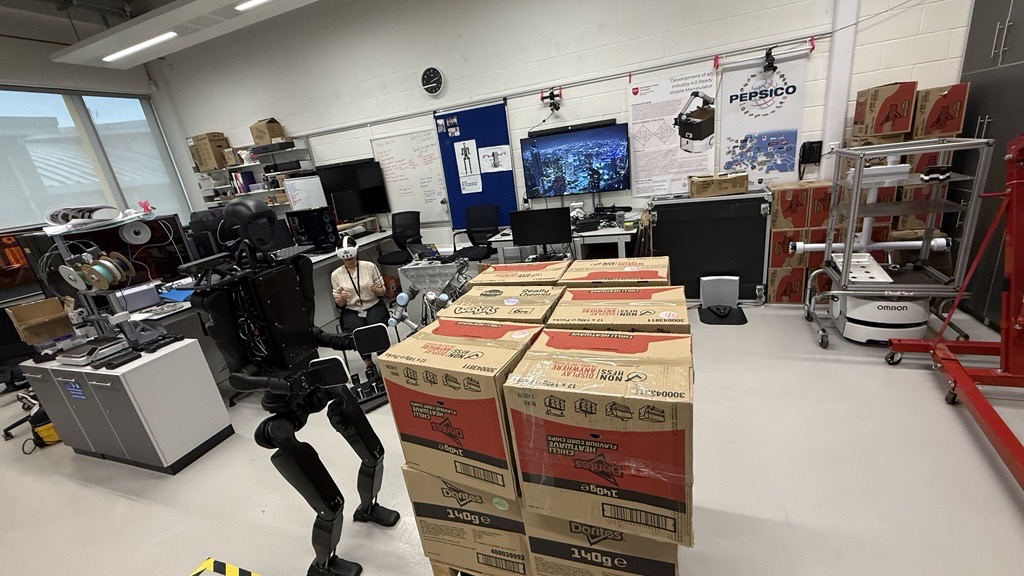 Humanoid robot palletising trials on the laboratory floor
